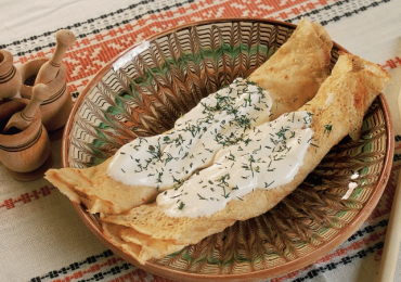 Crepes with sour cream and fresh cow cheese